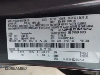 2018 Ford Fiesta SE with VIN 3FADP4BJXJM136232, listed as a IAAI auction lot 41901540 with 119,065 mi miles and . Bid and sale history available at DreamBid. Image 9.