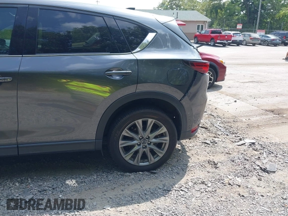 2020 Mazda CX-5 Grand Touring with VIN JM3KFBDM1L0821975, listed as a IAAI auction lot 40088794 with 68,895 mi miles and . Bid and sale history available at DreamBid. Image 19.