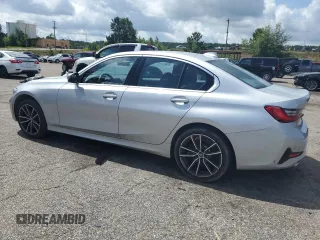 2020 BMW 3 Series 330i with VIN WBA5R1C07LFH40014, listed as a Copart auction lot 60656645 with 76,392 mi miles and Clean title. Bid and sale history available at DreamBid. Image 2.