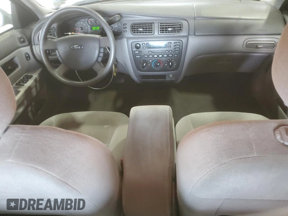 2007 Ford Taurus SE with VIN 1FAFP53U17A215432, listed as a Copart auction lot 64029215 with 121,190 mi miles and Salvage title. Bid and sale history available at DreamBid. Image 8.