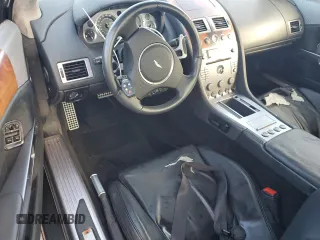2005 Aston Martin DB9 z VIN SCFAD01A75GA02198, wystawiony jako Copart lot #75564554 z przebiegiem Nie podano mil oraz Nie do naprawy • Non repairable. Historia ofert i sprzedaży dostępna na DreamBid. Obrazek 8.