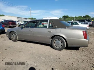 2001 Cadillac DeVille DHS z VIN 1G6KE57Y21U250470, wystawiony jako Copart lot #57334785 z przebiegiem 66 703 mil mil oraz Tytuł czysty. Historia ofert i sprzedaży dostępna na DreamBid. Obrazek 2.