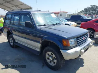 1995 Mitsubishi Montero z VIN JA4MR41H4SJ006684, wystawiony jako IAAI lot #42389482 z przebiegiem 399 099 mil mil oraz . Historia ofert i sprzedaży dostępna na DreamBid. Obrazek 1.