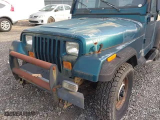 1995 Jeep Wrangler S with VIN 1J4FY19P5SP243137, listed as a IAAI auction lot 41787400 with 136,565 mi miles. Bid and sale history available at carsss.com. Image 6.
