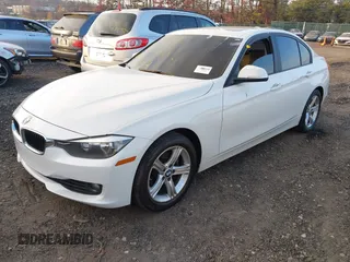 2014 BMW 3 Series 328i xDrive with VIN WBA3B5C52EF958635, listed as a IAAI auction lot 40916777 with 143,975 mi miles. Bid and sale history available at carsss.com. Image 2.