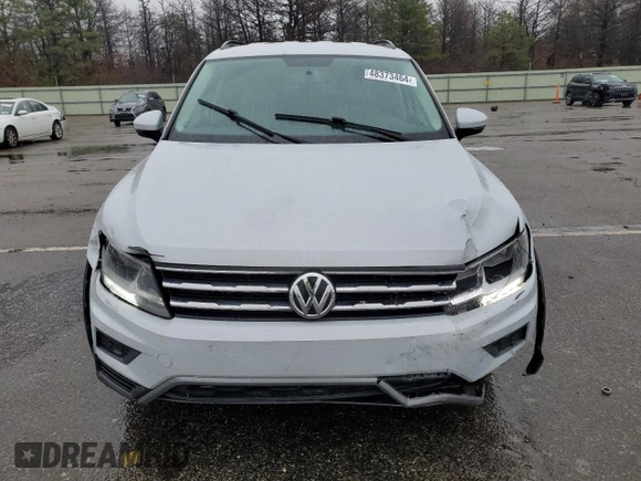 2018 Volkswagen Tiguan S with VIN 3VV1B7AX7JM072106, listed as a Copart auction lot 48373464 with 83,482 mi miles and Salvage title. Bid and sale history available at DreamBid. Image 5.