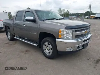 2013 Chevrolet Silverado 1500 LT with VIN 3GCPKSE74DG332907, listed as a IAAI auction lot 41951755 with 214,211 mi miles. Bid and sale history available at carsss.com. Image 1.