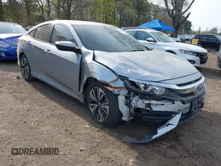 2018 Honda Civic Sedan LX with VIN 2HGFC2F5XJH573938, listed as a IAAI auction lot 42098109 with 69,037 mi miles. Bid and sale history available at carsss.com. Image 1.