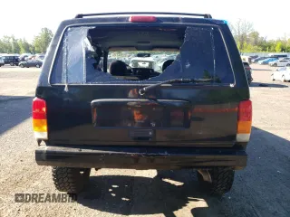 2000 Jeep Cherokee z VIN 1J4FF48S3YL180200, wystawiony jako Copart lot #55994215 z przebiegiem 209 182 mil mil oraz Szkoda całkowita • Salvage title. Historia ofert i sprzedaży dostępna na DreamBid. Obrazek 6.
