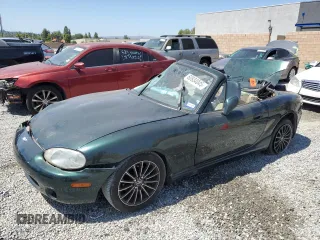 1999 Mazda MX-5 Miata with VIN JM1NB3530X0122338, listed as a Copart auction lot 60934045 with Not provided miles and Salvage title. Bid and sale history available at DreamBid. Image 1.