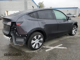2024 Tesla Model Y with VIN 7SAYGDED5RF093410, listed as a Copart auction lot 50557225 with 6,396 mi miles and Salvage Title. Bid and sale history available at DreamBid. Image 3.