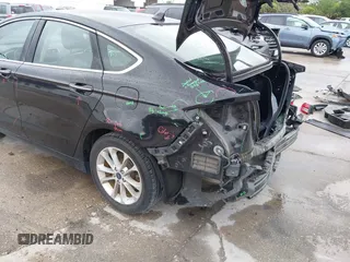 2019 Ford Fusion Hybrid SEL with VIN 3FA6P0MU1KR202860, listed as a IAAI auction lot 41983299 with 133,671 mi miles. Bid and sale history available at carsss.com. Image 3.