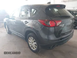2014 Mazda CX-5 Sport with VIN JM3KE4BE5E0375360, listed as a IAAI auction lot 41788977 with 135,487 mi miles. Bid and sale history available at carsss.com. Image 3.