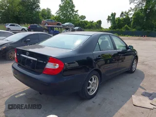 2003 Toyota Camry LE z VIN 4T1BE30KX3U197331, wystawiony jako IAAI lot #42298164 z przebiegiem 248 008 mil mil oraz . Historia ofert i sprzedaży dostępna na DreamBid. Obrazek 4.