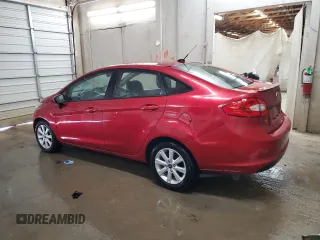 2012 Ford Fiesta SE with VIN 3FADP4BJ1CM147493, listed as a Copart auction lot 51436635 with 166,121 mi miles and Salvage Title. Bid and sale history available at DreamBid. Image 2.