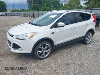 2016 Ford Escape Titanium z VIN 1FMCU9J90GUC76504, wystawiony jako IAAI lot #42552851 z przebiegiem 89 570 mil mil oraz . Historia ofert i sprzedaży dostępna na DreamBid. Obrazek 2.