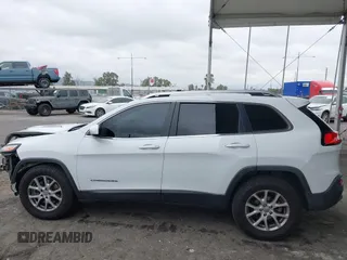 2015 Jeep Cherokee Latitude with VIN 1C4PJLCB5FW642701, listed as a IAAI auction lot 42063262 with 142,501 mi miles and . Bid and sale history available at carsss.com. Image 14.