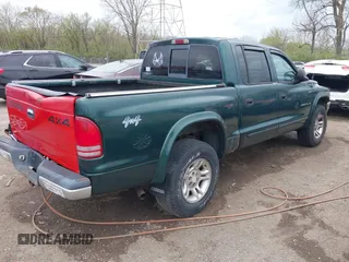 2001 Dodge Dakota Sport z VIN 1B7HG2ANX1S256902, wystawiony jako IAAI lot #42037703 z przebiegiem 121 914 mil mil oraz . Historia ofert i sprzedaży dostępna na DreamBid. Obrazek 4.
