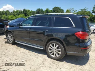 2015 Mercedes-Benz GL-Class GL 450 with VIN 4JGDF6EE1FA562088, listed as a Copart auction lot 58736934 with 104,550 mi miles and Salvage Title. Bid and sale history available at carsss.com. Image 2.