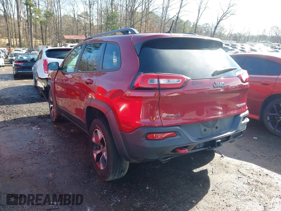 2014 Jeep Cherokee Trailhawk with VIN 1C4PJMBS0EW257133, listed as a IAAI auction lot 41446095 with 82,285 mi miles and . Bid and sale history available at DreamBid. Image 3.