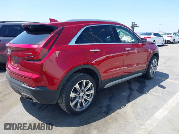 2021 Cadillac XT4 FWD Premium Luxury z VIN 1GYFZCR48MF004849, wystawiony jako IAAI lot #42131896 z przebiegiem 9 864 mil mil oraz . Historia ofert i sprzedaży dostępna na DreamBid. Obrazek 4.
