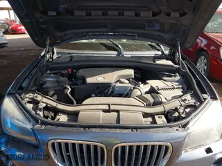 2013 BMW X1 28i with VIN WBAVM1C57DVW42096, listed as a IAAI auction lot 41572971 with 156,999 mi miles. Bid and sale history available at carsss.com. Image 10.