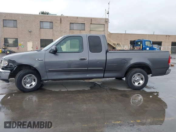 2003 Ford F-150 XL with VIN 1FTRX17W03NB51687, listed as a IAAI auction lot 41712022 with 183,428 mi miles. Bid and sale history available at carsss.com. Image 14.