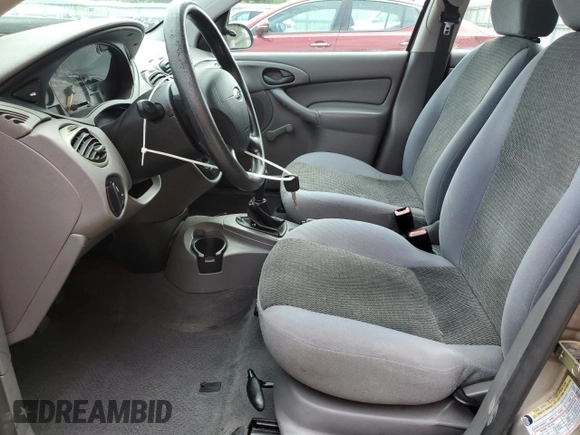 2004 Ford Focus LX with VIN 1FAFP33P24W148563, listed as a Copart auction lot 63869755 with 142,243 mi miles and Salvage title. Bid and sale history available at DreamBid. Image 7.