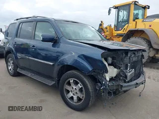 2009 Honda Pilot Touring with VIN 5FNYF48929B040199, listed as a IAAI auction lot 41466006 with 167,959 mi miles and . Bid and sale history available at carsss.com. Image 1.