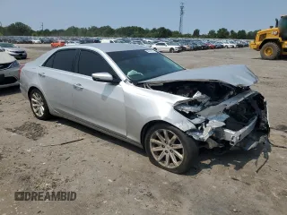 2014 Cadillac CTS Luxury AWD with VIN 1G6AX5SX5E0129143, listed as a Copart auction lot 58914015 with 131,465 mi miles and Salvage title. Bid and sale history available at DreamBid. Image 4.