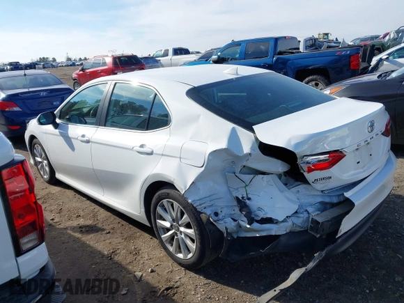 2020 Toyota Camry LE with VIN 4T1C11AKXLU986310, listed as a IAAI auction lot 40977100 with 108,208 mi miles and . Bid and sale history available at DreamBid. Image 3.