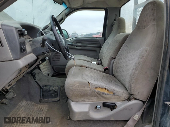 1999 Ford F-250 with VIN 1FTNF21S8XEA67992, listed as a Copart auction lot 44249795 with 157,528 mi miles and Salvage title. Bid and sale history available at DreamBid. Image 7.