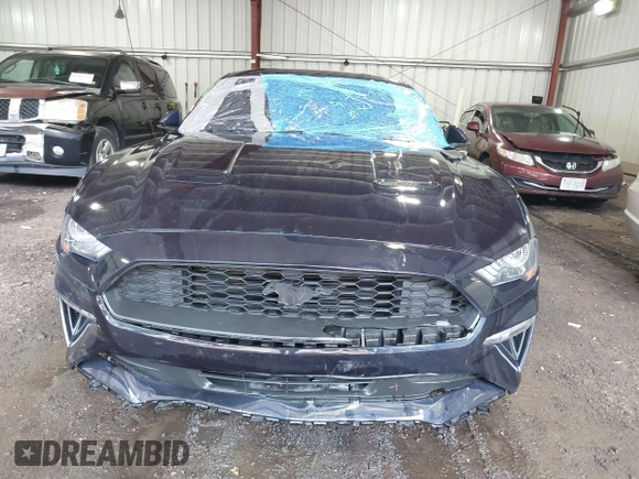 2021 Ford Mustang EcoBoost z VIN 1FA6P8TH4M5126706, wystawiony jako IAAI lot #42465164 z przebiegiem 49 795 mil mil oraz . Historia ofert i sprzedaży dostępna na DreamBid. Obrazek 6.