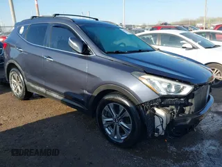 2016 Hyundai Santa Fe z VIN 5XYZUDLB3GG312687, wystawiony jako IAAI lot #42096854 z przebiegiem 162 586 mil mil oraz . Historia ofert i sprzedaży dostępna na DreamBid. Obrazek 1.