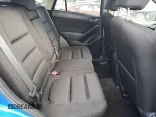 2014 Mazda CX-5 Touring with VIN JM3KE4CY3E0381134, listed as a Copart auction lot 52115015 with 52,162 mi miles and Salvage Title. Bid and sale history available at carsss.com. Image 11.
