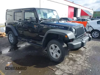 2011 Jeep Wrangler Unlimited Rubicon with VIN 1J4BA6H13BL513311, listed as a IAAI auction lot 41809207 with 124,716 mi miles and . Bid and sale history available at DreamBid. Image 1.