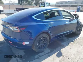 2018 Tesla Model 3 Long Range Battery with VIN 5YJ3E1EA4JF011799, listed as a IAAI auction lot 41765860 with 133,098 mi miles. Bid and sale history available at carsss.com. Image 4.