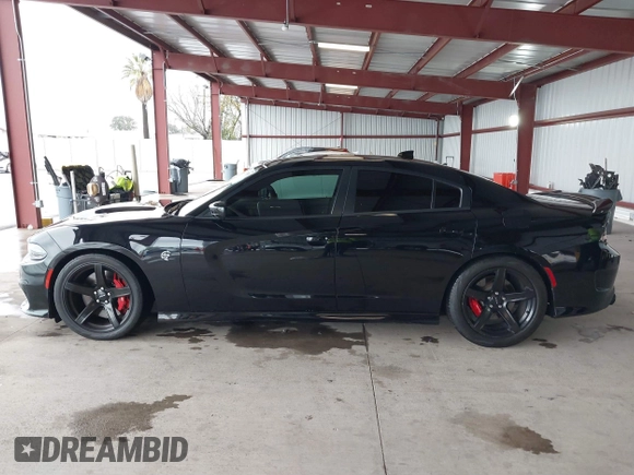 2019 Dodge Charger SRT Hellcat with VIN 2C3CDXL97KH552439, listed as a IAAI auction lot 41813879 with 58,921 mi miles and . Bid and sale history available at DreamBid. Image 14.