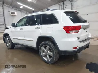 2013 Jeep Grand Cherokee Overland with VIN 1C4RJFCT1DC586886, listed as a IAAI auction lot 41941590 with 125,126 mi miles. Bid and sale history available at carsss.com. Image 3.
