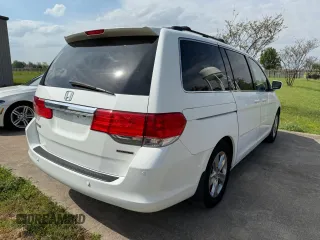 2010 Honda Odyssey Touring with VIN 5FNRL3H94AB047330, listed as a Copart auction lot 54064195 with 193,979 mi miles and Clean Title. Bid and sale history available at carsss.com. Image 4.