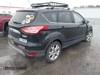 2015 Ford Escape Titanium with VIN 1FMCU0J97FUB45709, listed as a IAAI auction lot 41561636 with 88,296 mi miles. Bid and sale history available at carsss.com. Image 4.