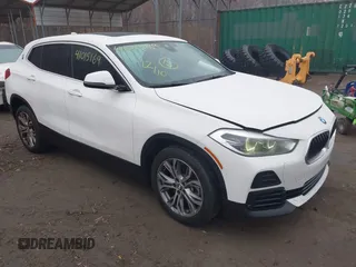 2022 BMW X2 sDrive28i with VIN WBXYH9C04N5U25732, listed as a IAAI auction lot 41015169 with 65,526 mi miles. Bid and sale history available at carsss.com. Image 1.