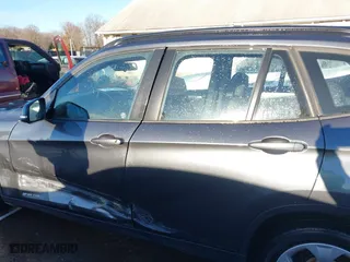2014 BMW X1 sDrive28i with VIN WBAVM1C52EVW55890, listed as a IAAI auction lot 41512784 with 97,718 mi miles. Bid and sale history available at carsss.com. Image 14.