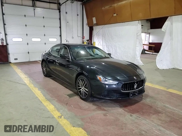2015 Maserati Ghibli z VIN ZAM57XSA9F1139087, wystawiony jako Copart lot #52235355 z przebiegiem 68 788 mil mil oraz Szkoda całkowita • Salvage title. Historia ofert i sprzedaży dostępna na DreamBid. Obrazek 13.
