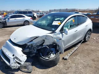 2021 Tesla Model Y Long Range with VIN 5YJYGDEE0MF106255, listed as a IAAI auction lot 41736610 with Not Provided miles. Bid and sale history available at carsss.com. Image 6.