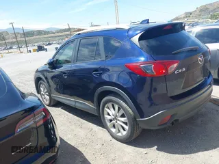 2014 Mazda CX-5 Grand Touring with VIN JM3KE2DY7E0376389, listed as a IAAI auction lot 42014946 with 126,081 mi miles. Bid and sale history available at carsss.com. Image 3.