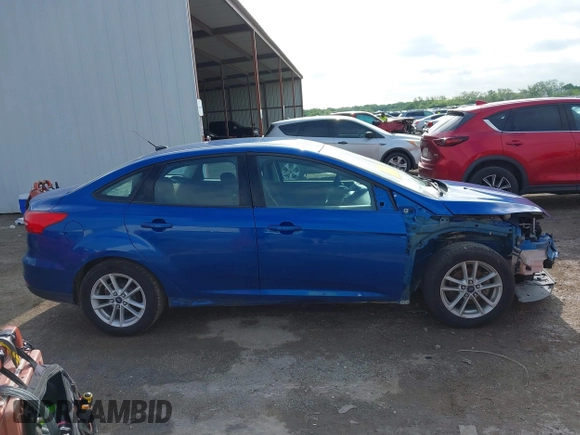 2018 Ford Focus SE z VIN 1FADP3F2XJL293337, wystawiony jako IAAI lot #42121294 z przebiegiem 71 241 mil mil oraz . Historia ofert i sprzedaży dostępna na DreamBid. Obrazek 13.