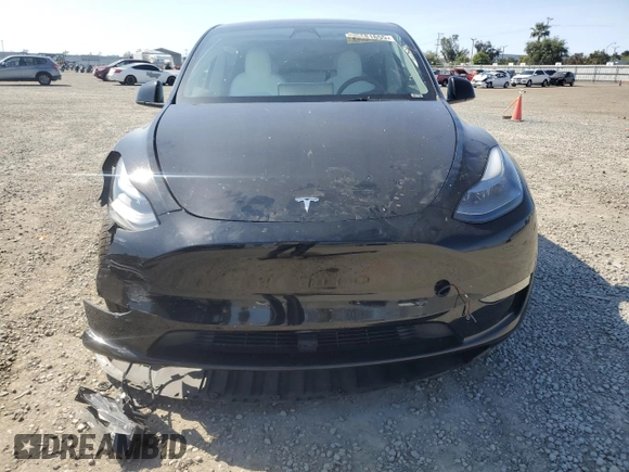 2023 Tesla Model Y Long Range with VIN 7SAYGAEE0PF642810, listed as a Copart auction lot 52181655 with 74,922 mi miles and Salvage Title. Bid and sale history available at DreamBid. Image 5.