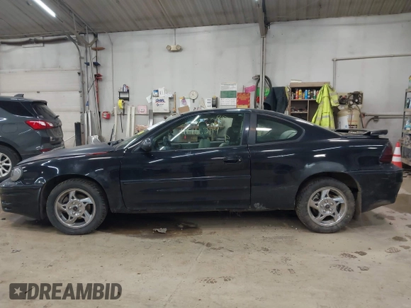 2005 Pontiac Grand Am GT with VIN 1G2NW12E85M140434, listed as a IAAI auction lot 41966294 with 142,548 mi miles. Bid and sale history available at carsss.com. Image 14.