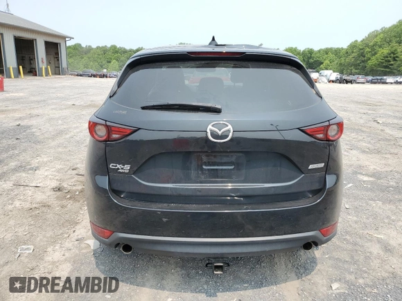 2019 Mazda CX-5 Grand Touring with VIN JM3KFBDM2K0569829, listed as a Copart auction lot 59060965 with 99,359 mi miles and Salvage title. Bid and sale history available at DreamBid. Image 6.